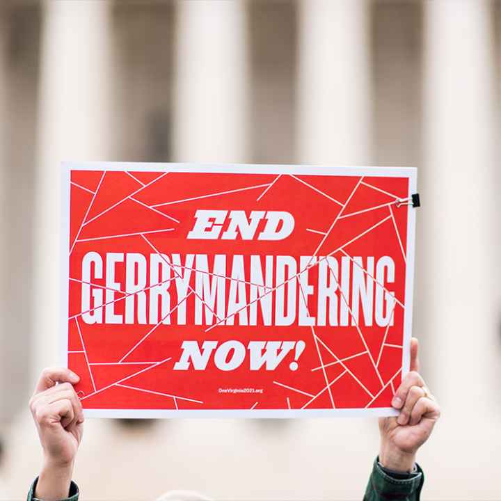 Gerrymandering activists gather on the steps of the Supreme Court as the court prepares to hear the the Benisek v. Lamone case on Wednesday, March 28, 2018.